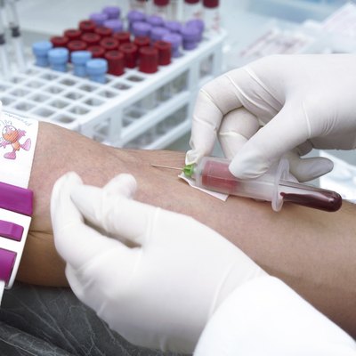 Doctor is taking blood for test.
