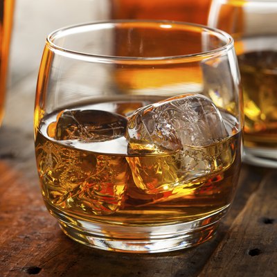 Alcoholic Whiskey Bourbon in a Glass with Ice