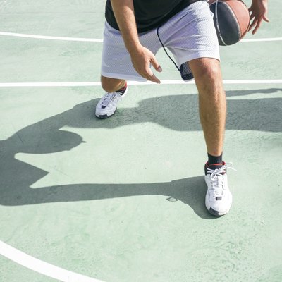 Legs of a man playing basketball