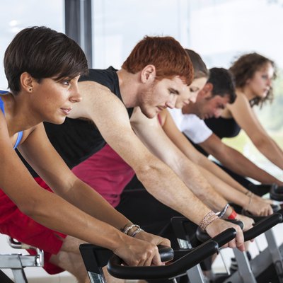 Group of People Cycling at Gym