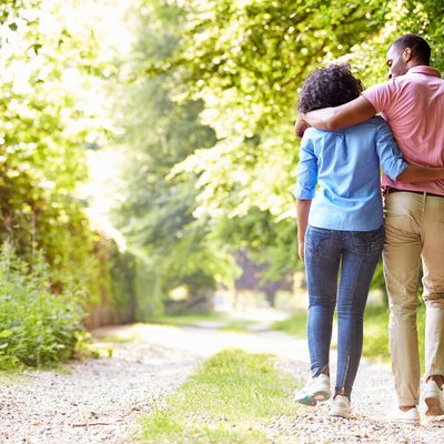 Young Couple Walking In Countryside