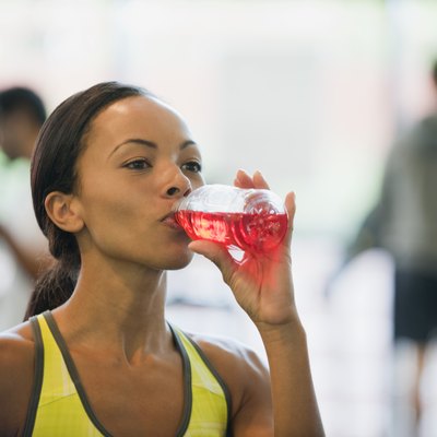 Young woman drinking sports drink
