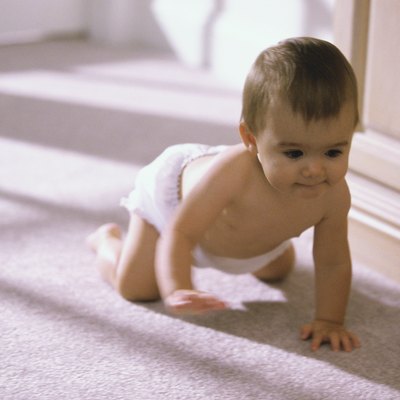 Baby boy crawling on the floor