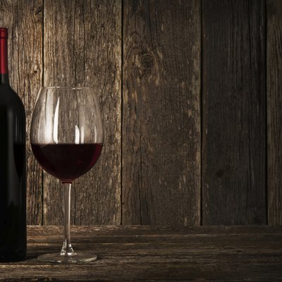 Bottle of red wine and glass