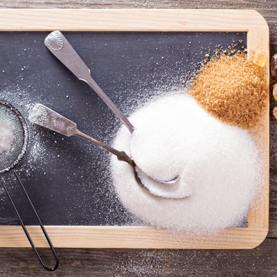 Variety of sugars on a chalkboard