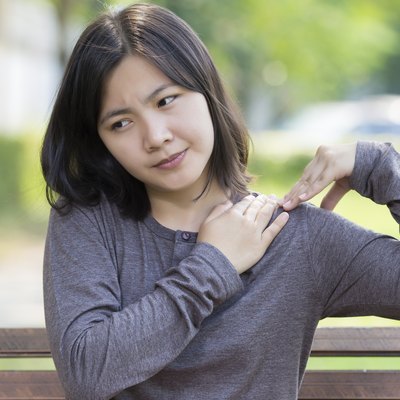 Woman: Shoulder Pain at Park