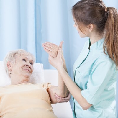 Elderly women having arm examination