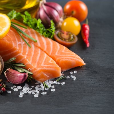 Portion of fresh salmon with spices,herbs and vegetables