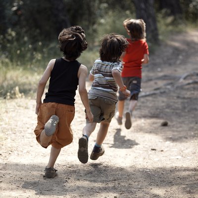 boys running on trail