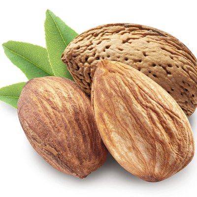 Almonds with leaves isolated.