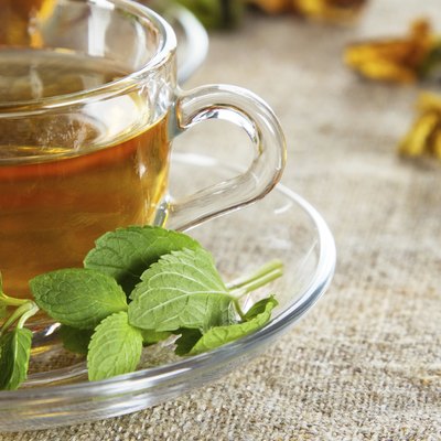 Tea cup with fresh mint leaves