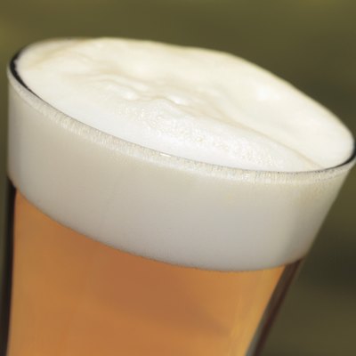 close-up of a head of beer in a glass