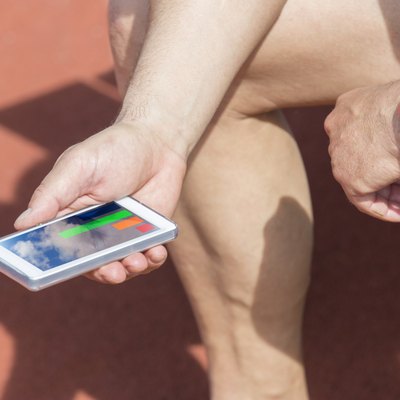 athlete checking fitness statistic