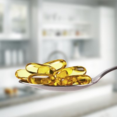 spoon full of fish oil capsules