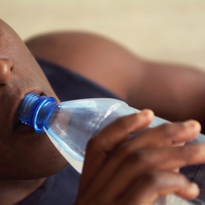 Man drinking bottled water, close-up