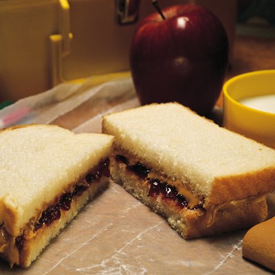 School lunch with peanut butter and jelly sandwich