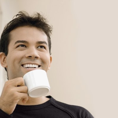 Close-up of a businessman holding a cup of tea