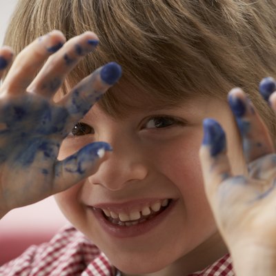 Boy with paint on his hands