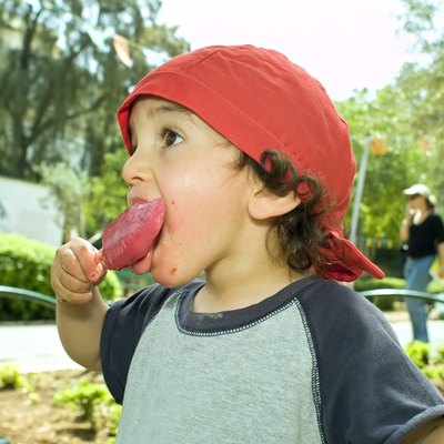 boy licking a popsicle