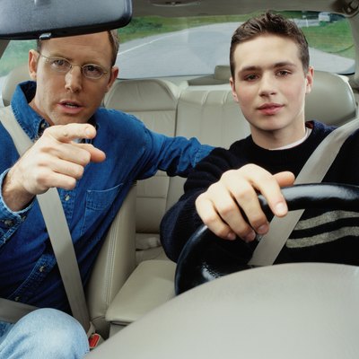 Man Teaching a Boy How to Drive