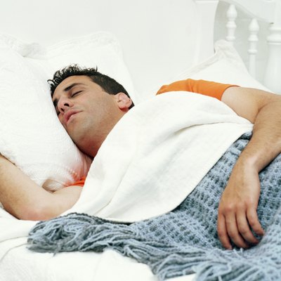 Man sleeping in bed