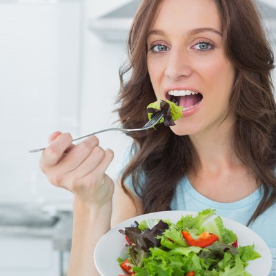 Brunette eating healthy salad
