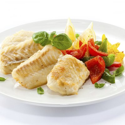 Fried cod fillets and vegetables