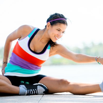 Fit woman stretching