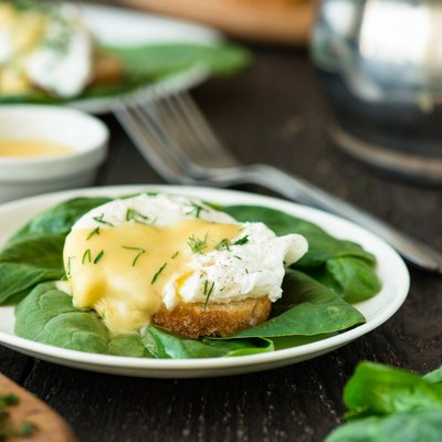 Poached egg on a piece of bread with spinach