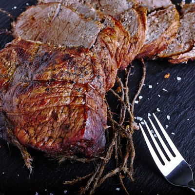 Roast beef on black stone board