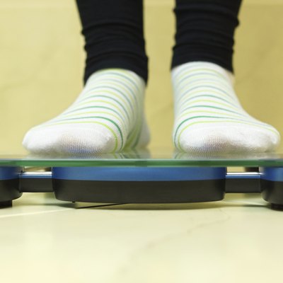 Woman standing on scales