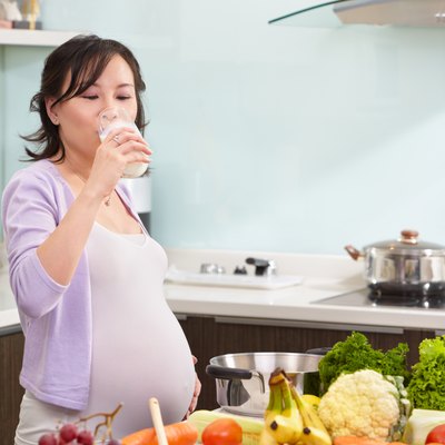 Pregnant lady drinking milk