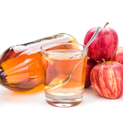 Apple cider vinegar with fresh apple as prop, healthy drink
