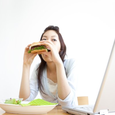 Young woman eating a hamburger
