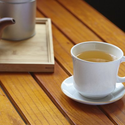 tea pot and cup on table