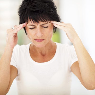 mid age woman having headache
