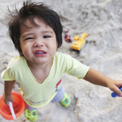 little boy in the sandpit
