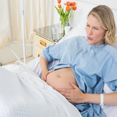 Expectant woman suffering from labor pains