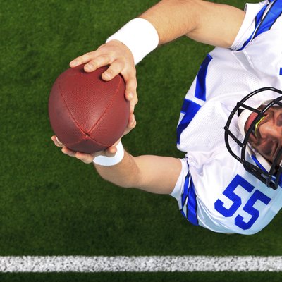 Overhead American football player catching the ball