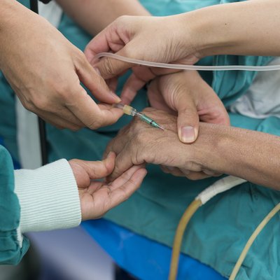 anesthesiologist doctor open intravenous fluid