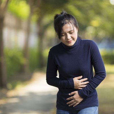 Woman Has Stomach Ache at Park