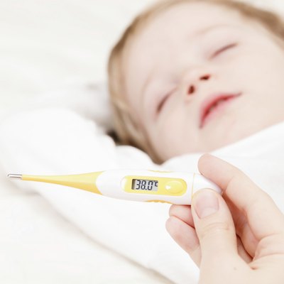 Fever, measuring temperature for little boy