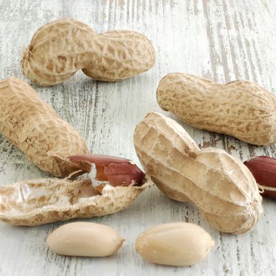 Peanuts on old wooden table