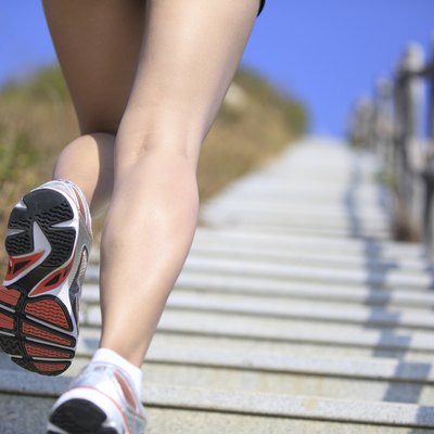 woman running up on mountain stairs