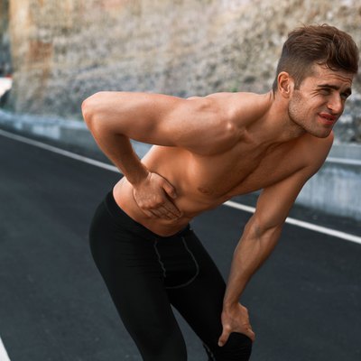 Man Suffering From Stomach Pain After Running Outdoors. Sport In