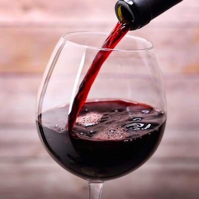 Pouring red wine into glass