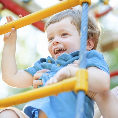 Little boy climbing ladder