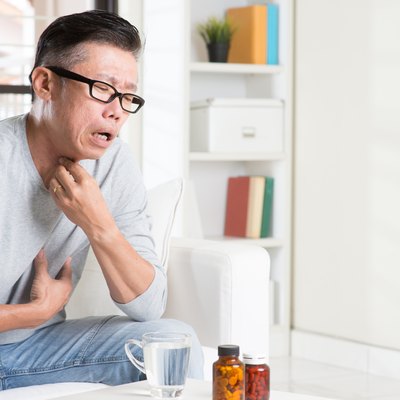 Mature Asian man throat pain