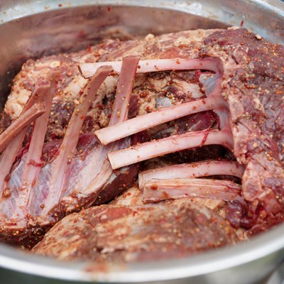 Raw venison meat marinated in spices