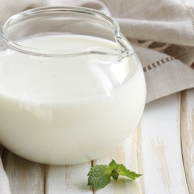 glass jug with milk, rustic style